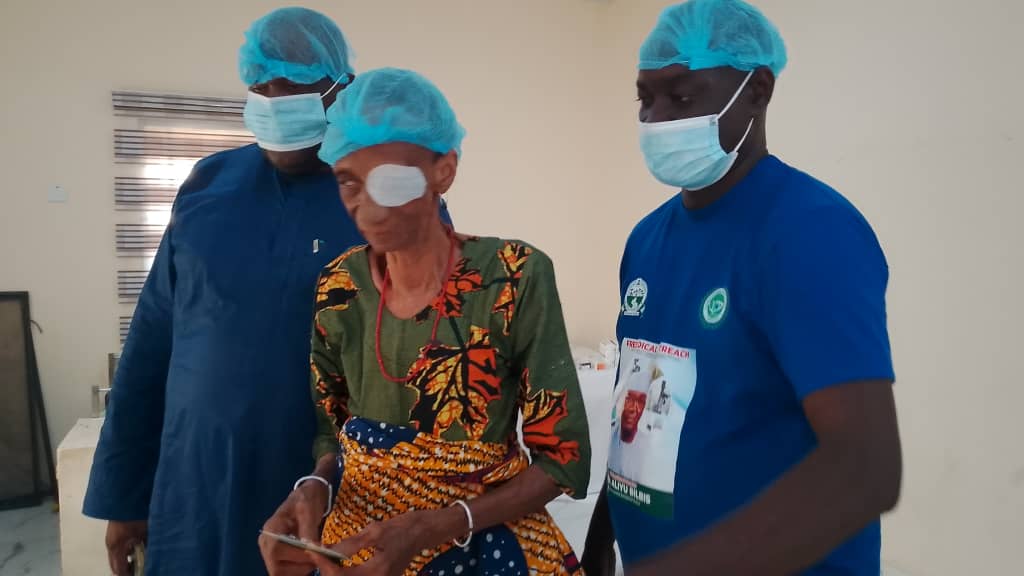 A patient with family after eye surgery during outreach
